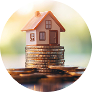 A small house on a stack of coins